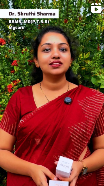 Woman in a red saree holding Bubblez skincare products against a green background